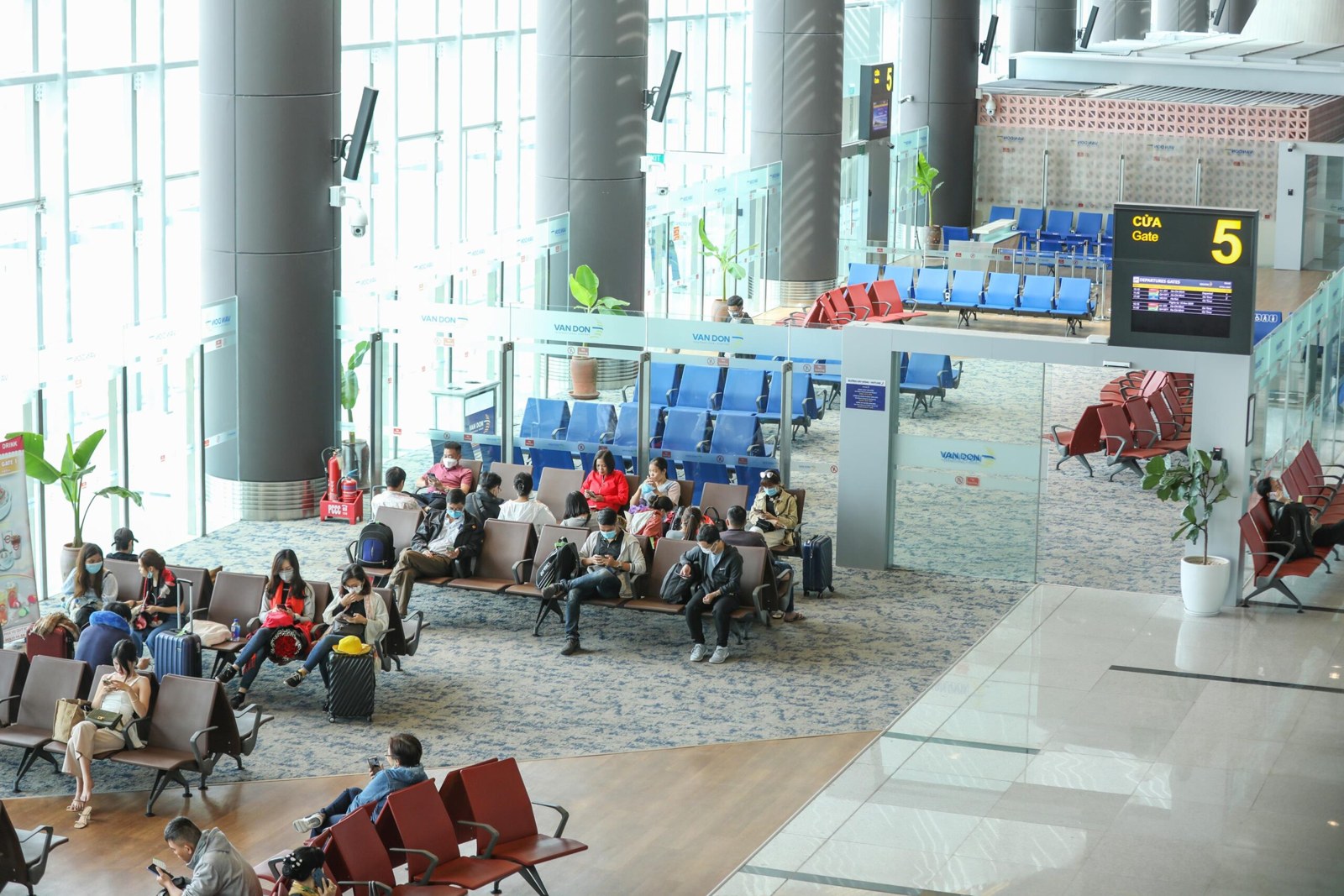 Passengers waiting at a departure gate in Van Don